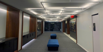View inside of an office building showcasing the ceiling lights
